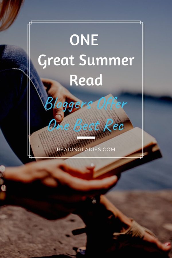 One Great Summer Read: tight focus a the book a woman is reading on the sand next to a body of water